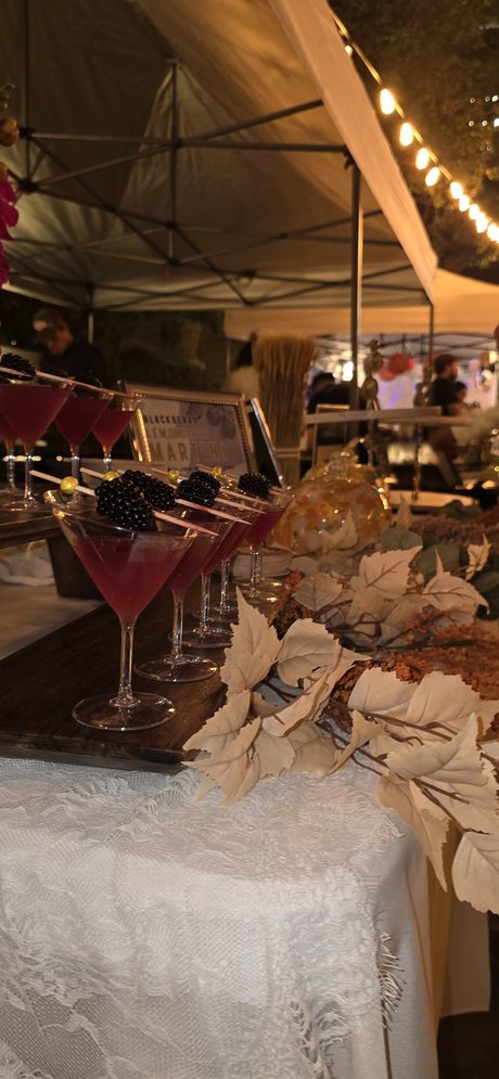 Top Shelf night: blackberry martinis lined up on the lace-covered bar